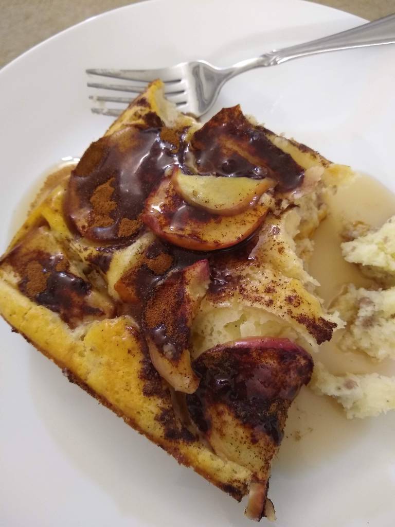 A sausage and cinnamon apple pancake dish.